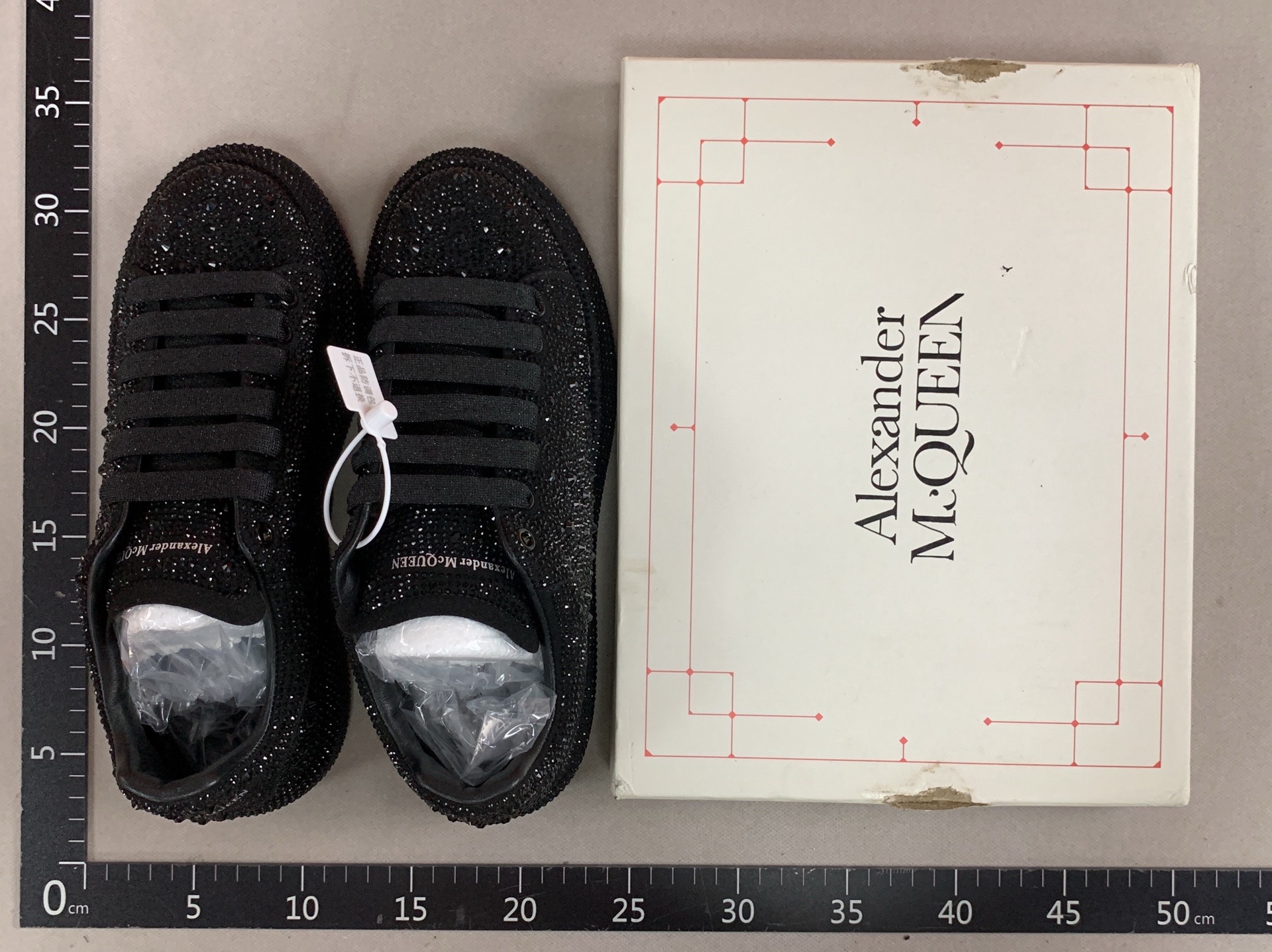 Rhinestone-encrusted, black diamond star-style platform sneakers for couples, made with genuine cowhide leather, featuring a chunky sole and a “graffiti mcqueen” design